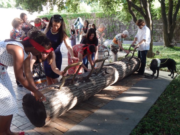 Blind-folded touch-tour attendees experience Jurgen Bey's "Tree-Trunk Bench" (1999) in our Sculpture Garden.